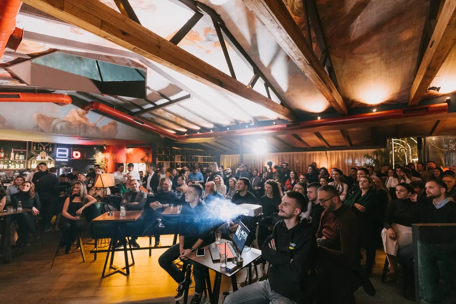 A room full of people gathered for a community event