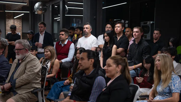 Guests listening and exchanging ideas at a Melbourne storytelling event.