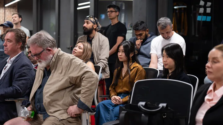 Guests listening and exchanging ideas at a Melbourne storytelling event.
