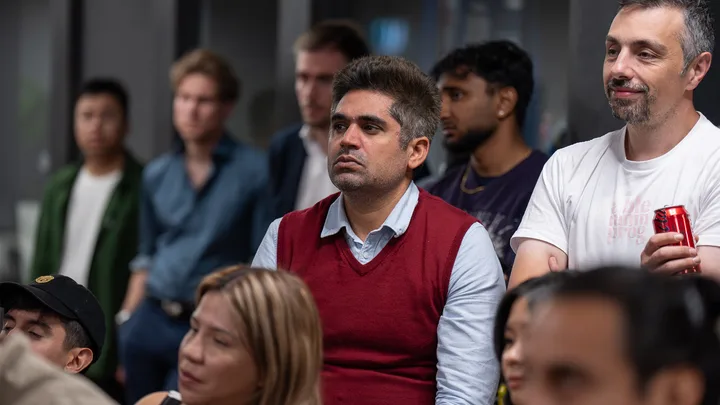 Guests listening and exchanging ideas at a Melbourne storytelling event.