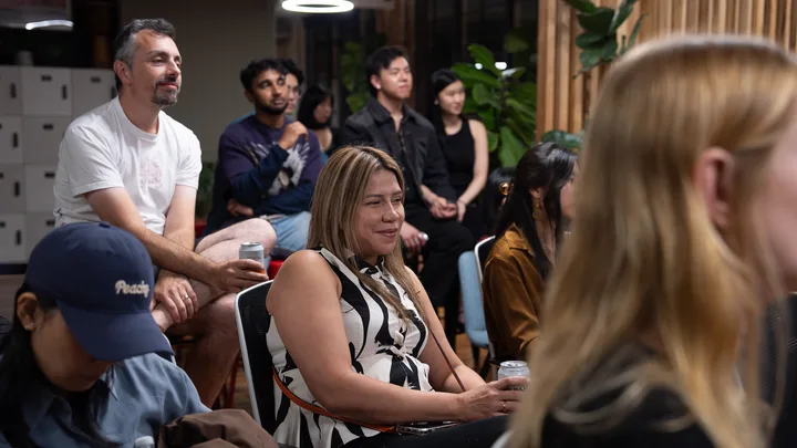 Guests listening and exchanging ideas at a Melbourne storytelling event.