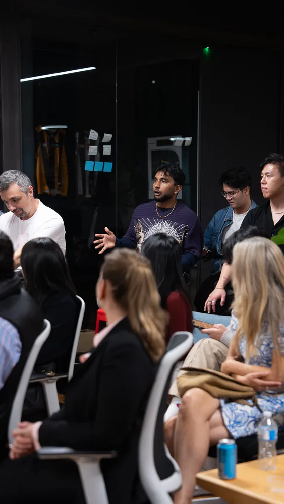 Guests listening and exchanging ideas at a Melbourne storytelling event.