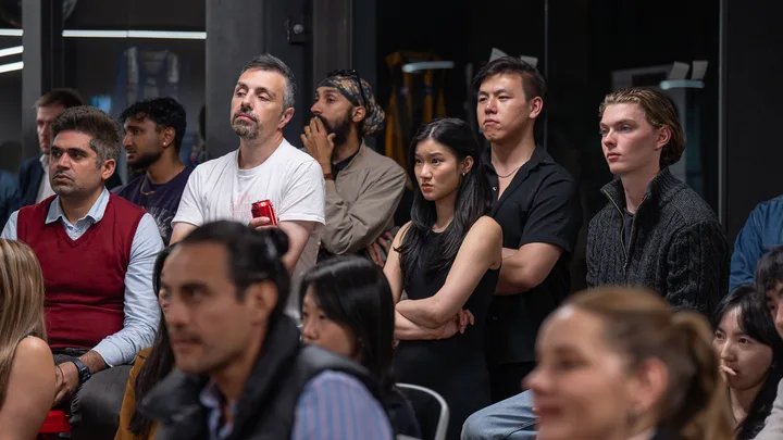 Guests listening and exchanging ideas at a Melbourne storytelling event.