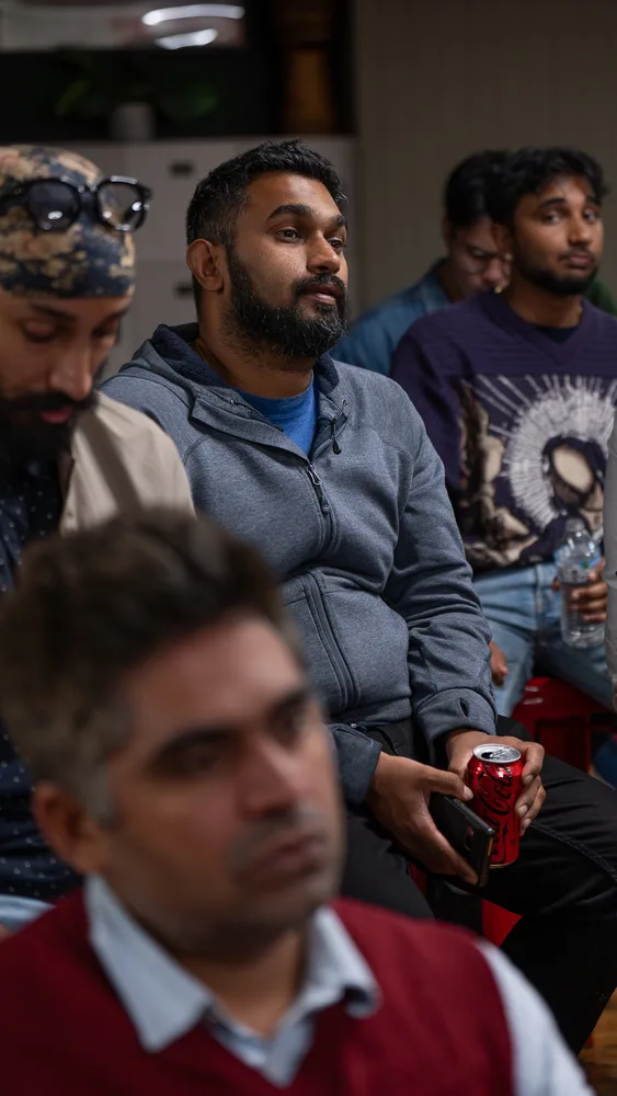 Guests listening and exchanging ideas at a Melbourne storytelling event.