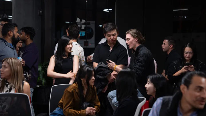 Guests listening and exchanging ideas at a Melbourne storytelling event.
