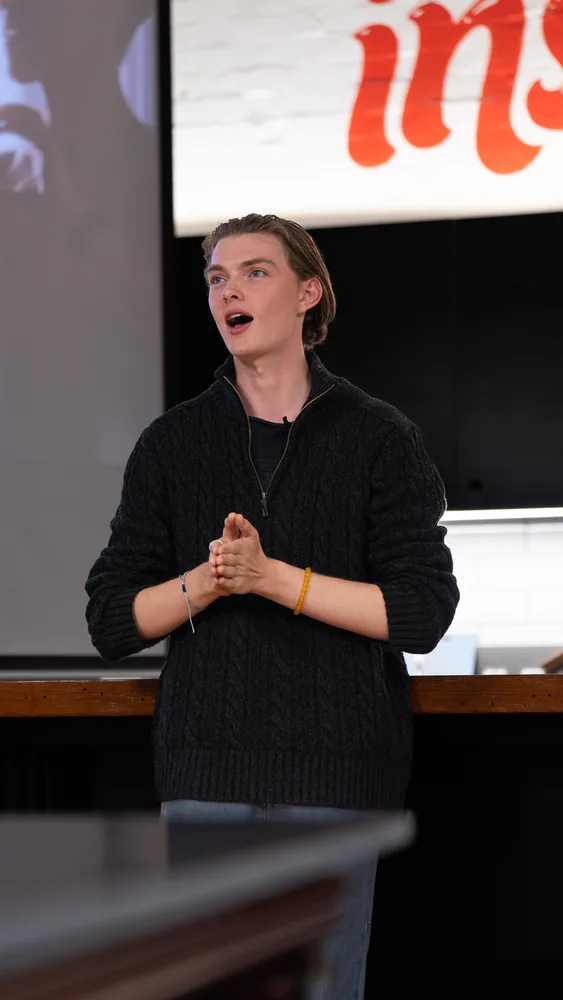 A speaker sharing their story at Inspire9.