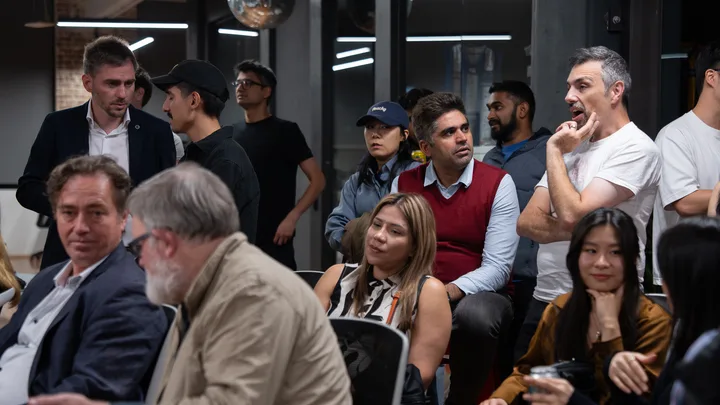 Guests listening and exchanging ideas at a Melbourne storytelling event.