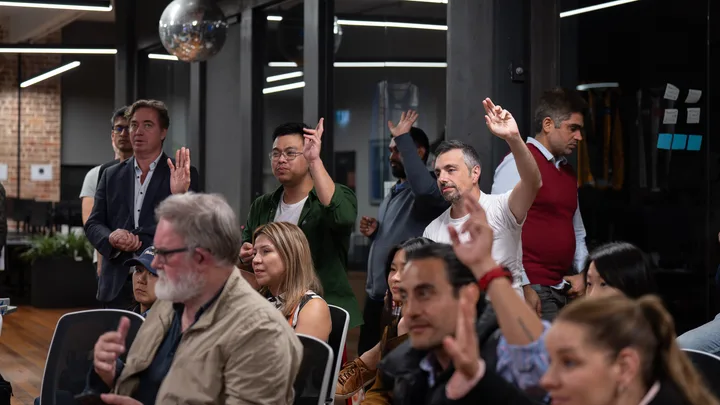 Guests listening and exchanging ideas at a Melbourne storytelling event.