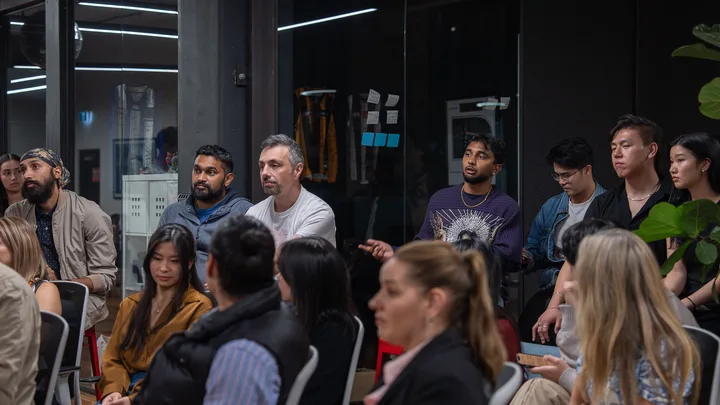 Guests listening and exchanging ideas at a Melbourne storytelling event.