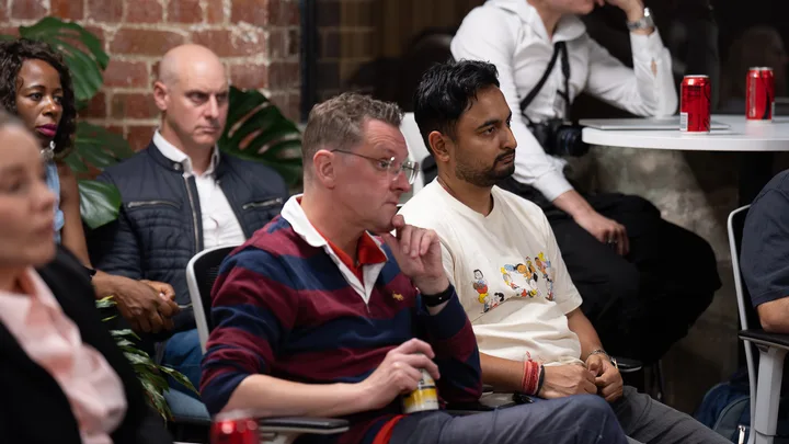 Guests listening and exchanging ideas at a Melbourne storytelling event.