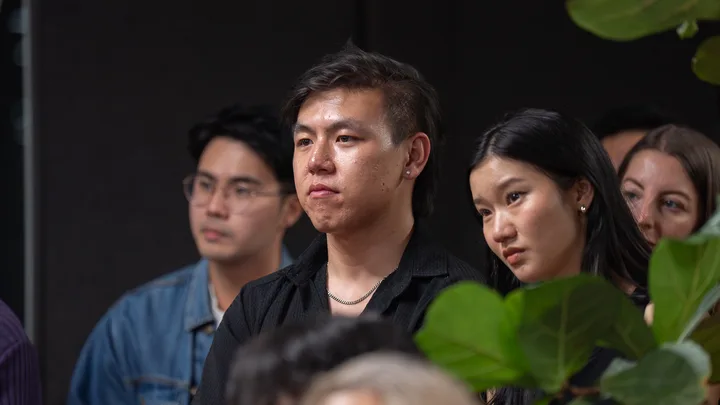 Guests listening and exchanging ideas at a Melbourne storytelling event.