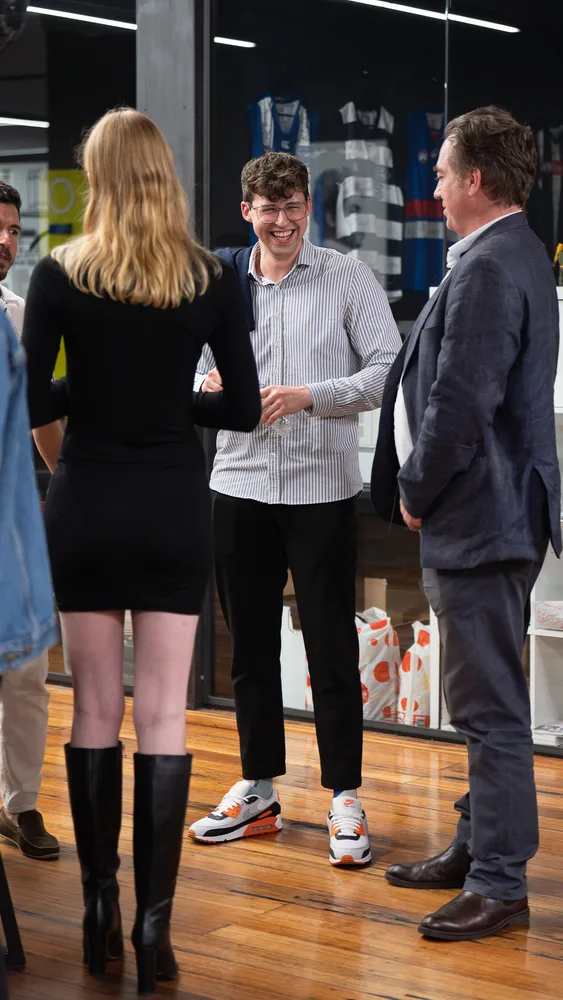 Guests talking together after the presentations.