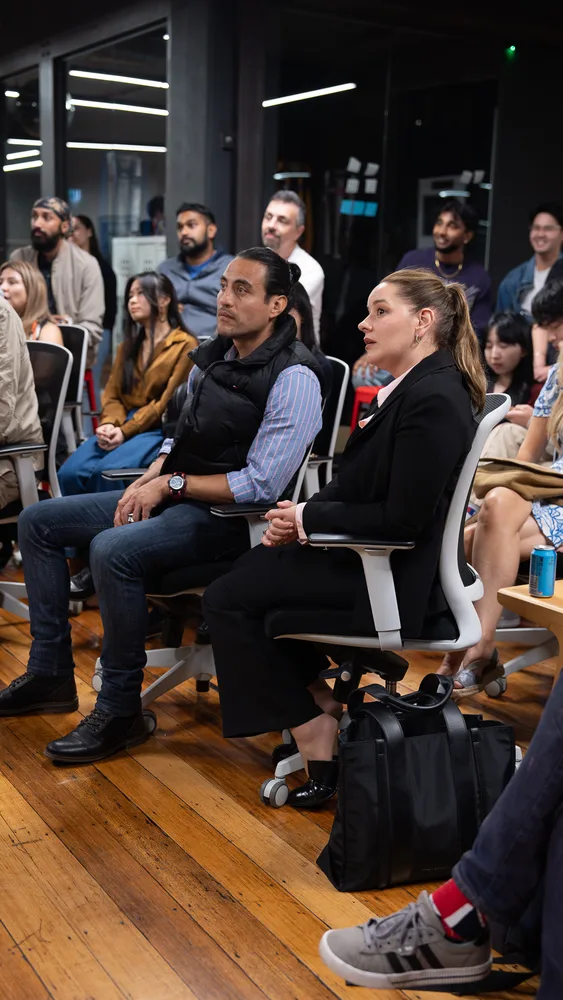 Guests listening and exchanging ideas at a Melbourne storytelling event.