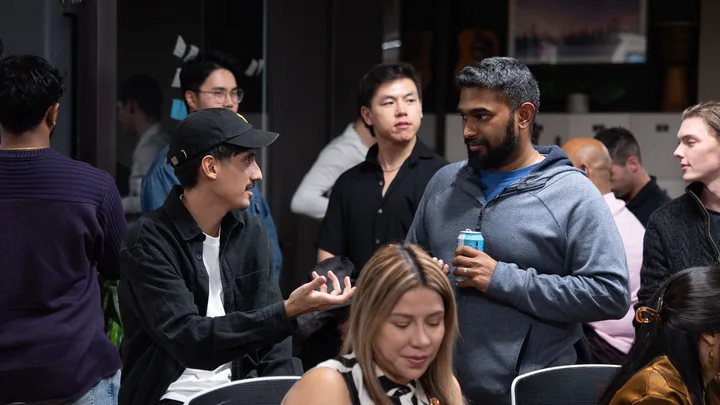 Guests listening and exchanging ideas at a Melbourne storytelling event.