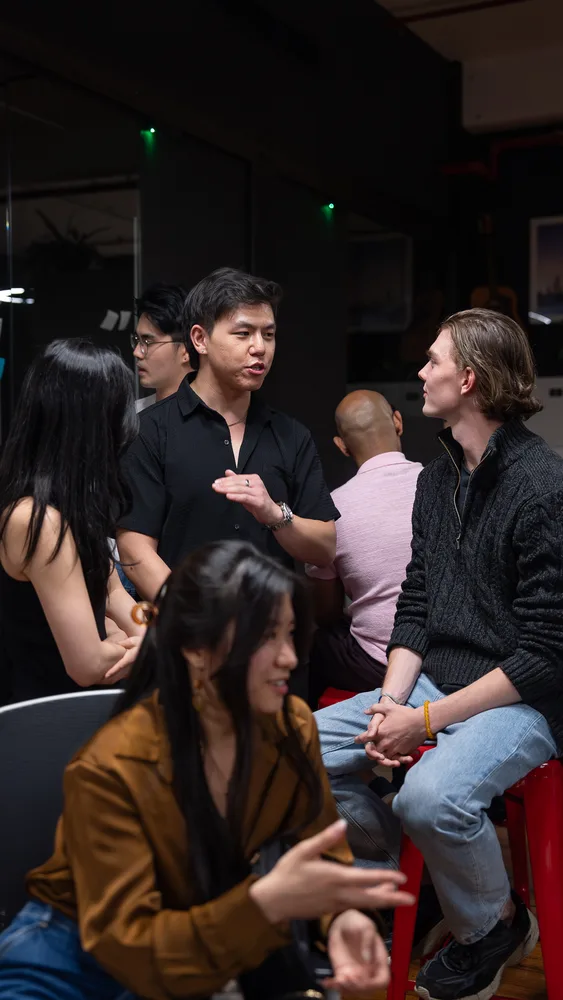 Guests listening and exchanging ideas at a Melbourne storytelling event.