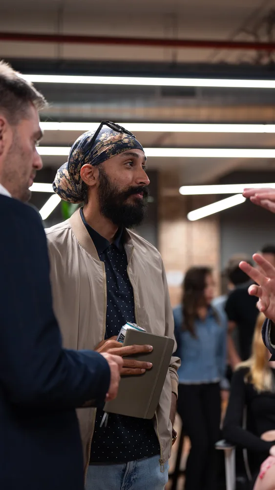 Guests listening and exchanging ideas at a Melbourne storytelling event.