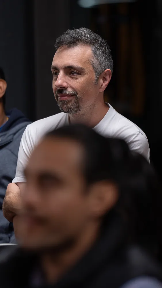 Guests listening and exchanging ideas at a Melbourne storytelling event.